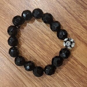Black beaded bracelet with sparking charm